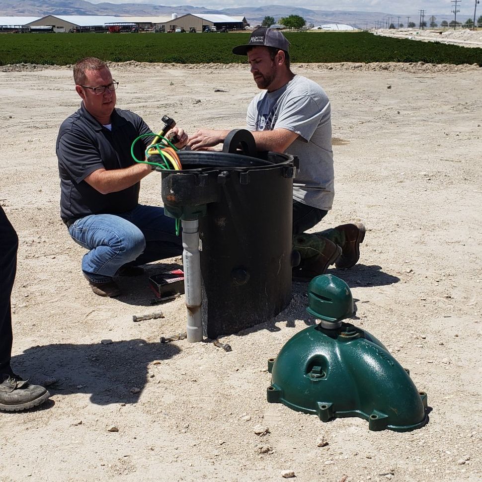 Technicians working on an in-well pump in Nampa ID